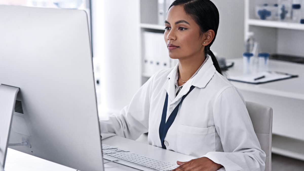 Cropped shot of an attractive young female scientist working on her computer in the laboratory.