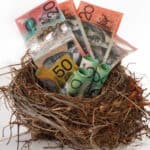 Australian dollar notes in a nest, symbolising a nest egg.