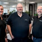Group image of Aussie Broadband leaders Michael Omeros, Phillip Britt and Brian Maher.
