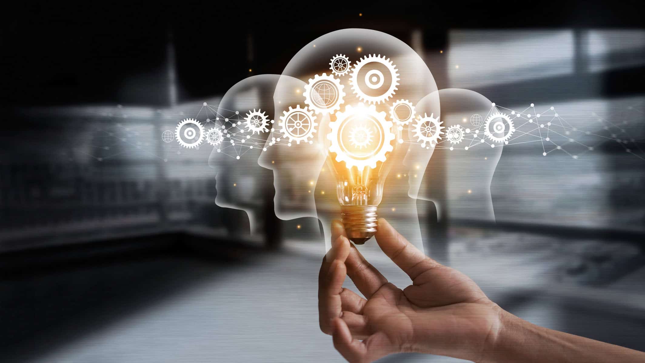 Innovation gears icon on a light bulb with network connection on human heads.