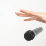 Hand dropping a mic.