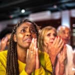 Sports fans watching a match at a bar.