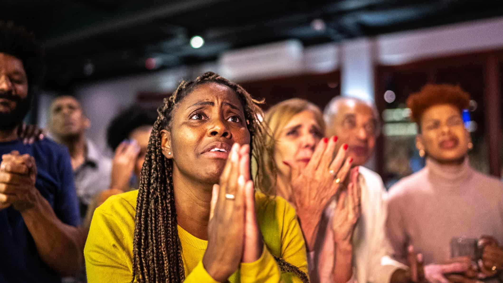 Sports fans watching a match at a bar.
