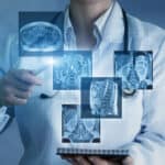 Doctor sees virtual images of the patient's x-rays on a blue background.