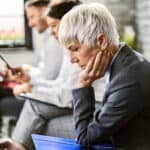 Disappointed woman waiting for an appointment.
