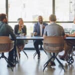 Meeting taking place amongst members of a board.