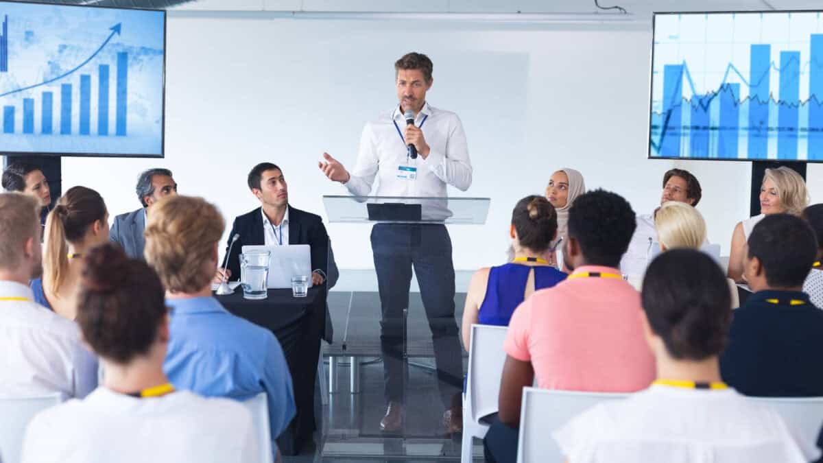 Company's CEO at a meeting with workers talking about earnings results.