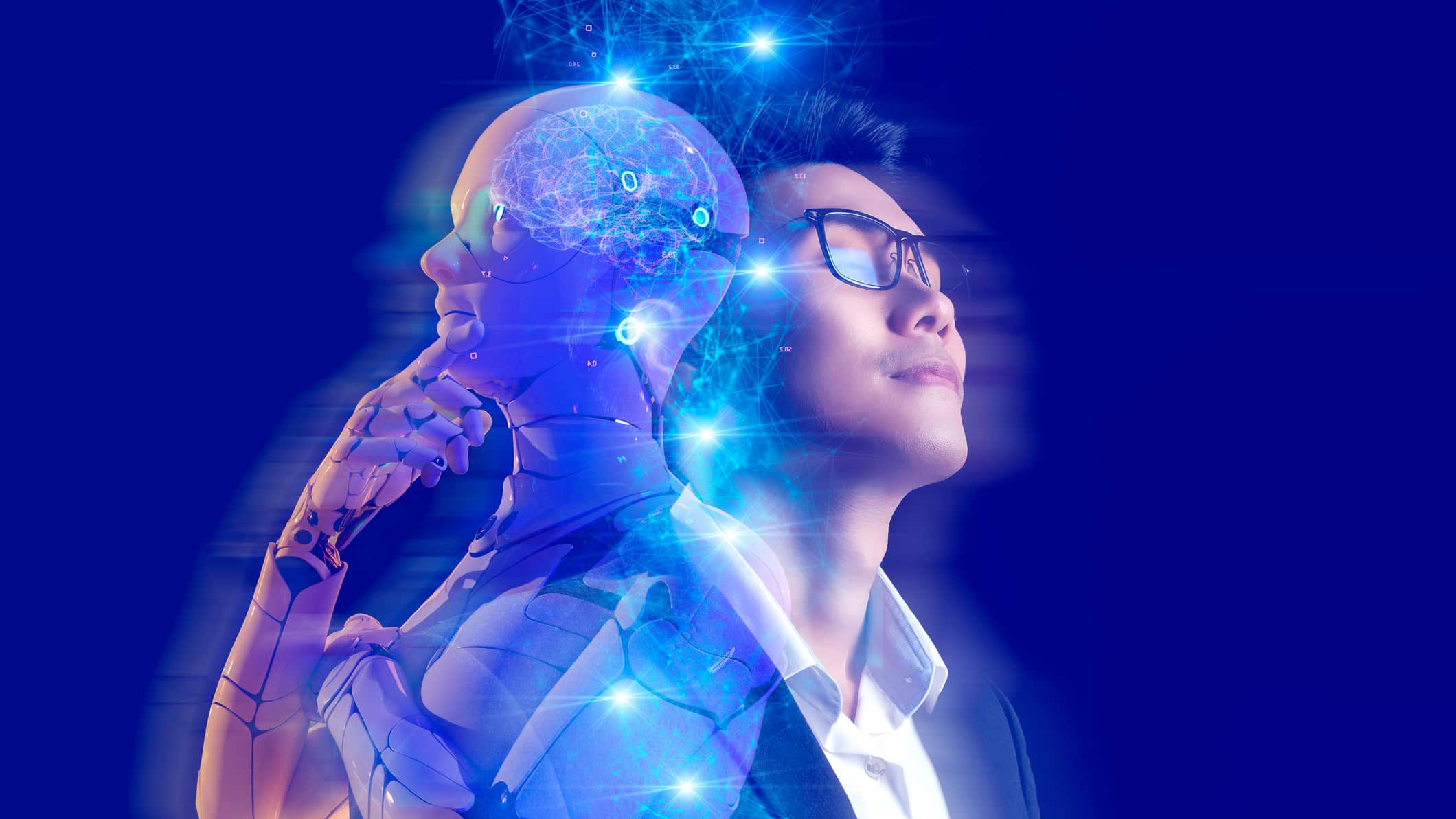 Hologram of a man next to a human robot, symbolising artificial intelligence.