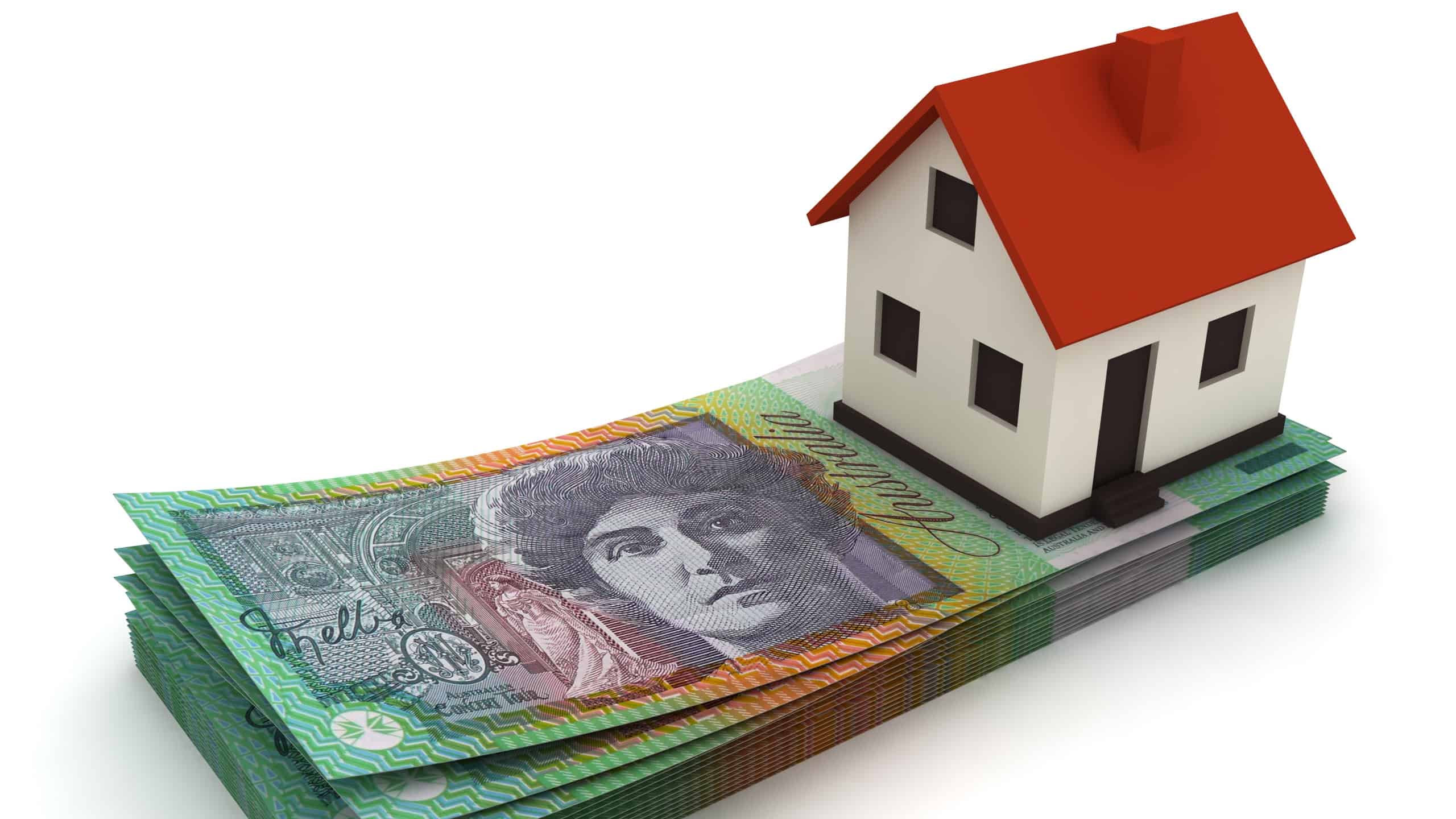 A toy house sits on a pile of Australian $100 notes.