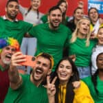 Fans are cheering for their team at a stadium.