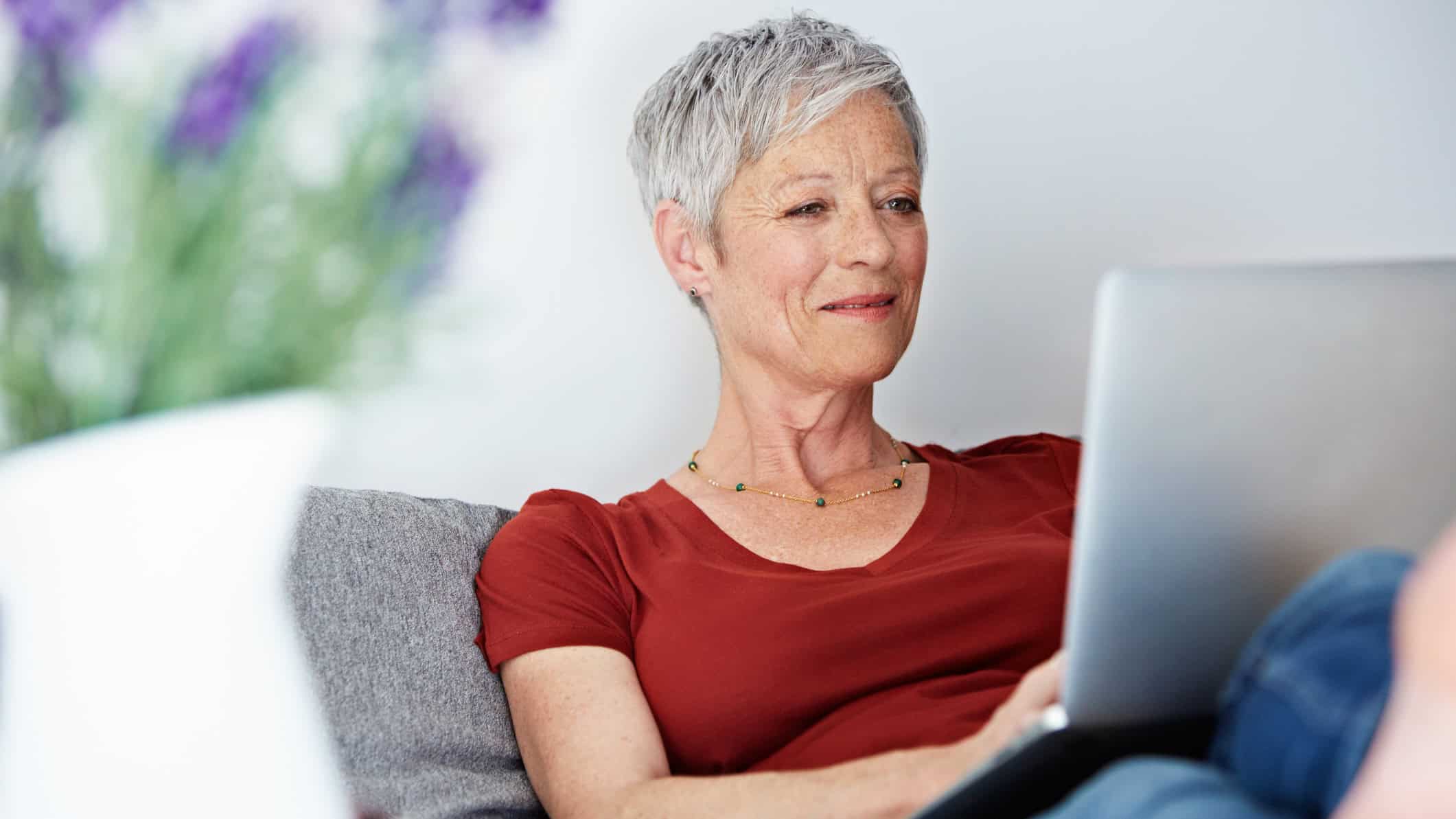 Woman using her laptop with her feet up.