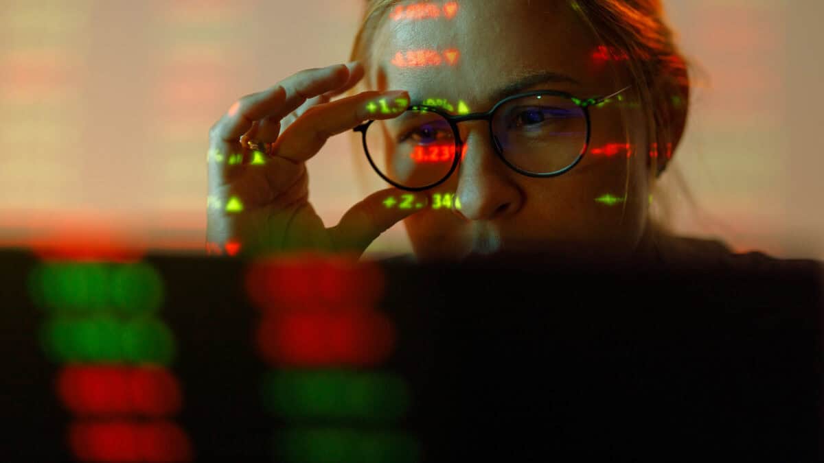 Woman looking at stock market numbers.