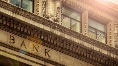 Bank written on a brown building.