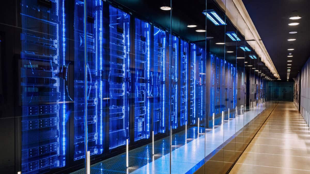 View of a row of blue and black server racks in a data centre.