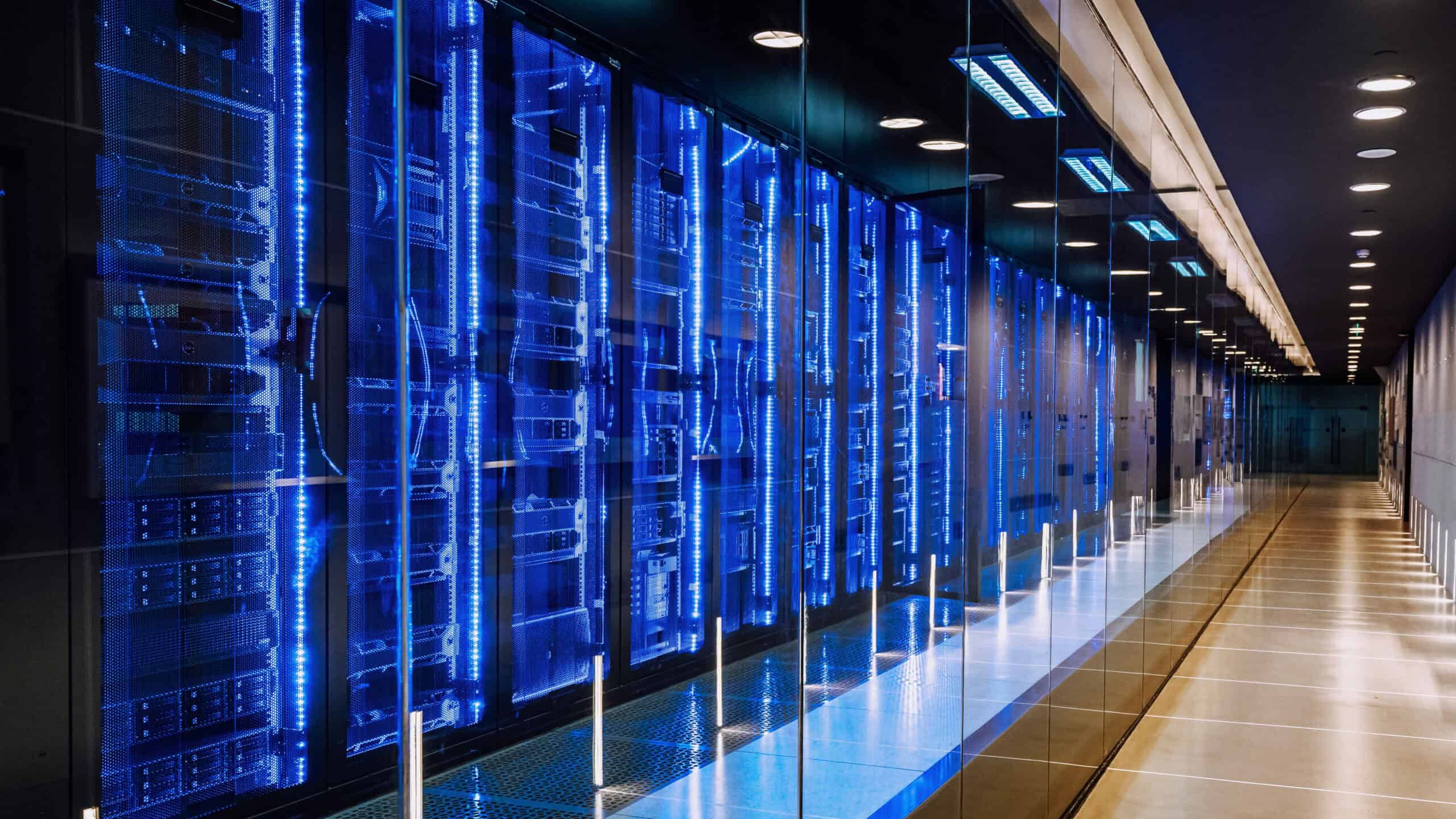 View of a row of blue and black server racks in a data centre.
