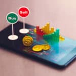 Buy and sell signs on smartphone along with coins and graph models.