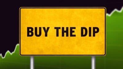 Buy the dip written on a yellow sign.