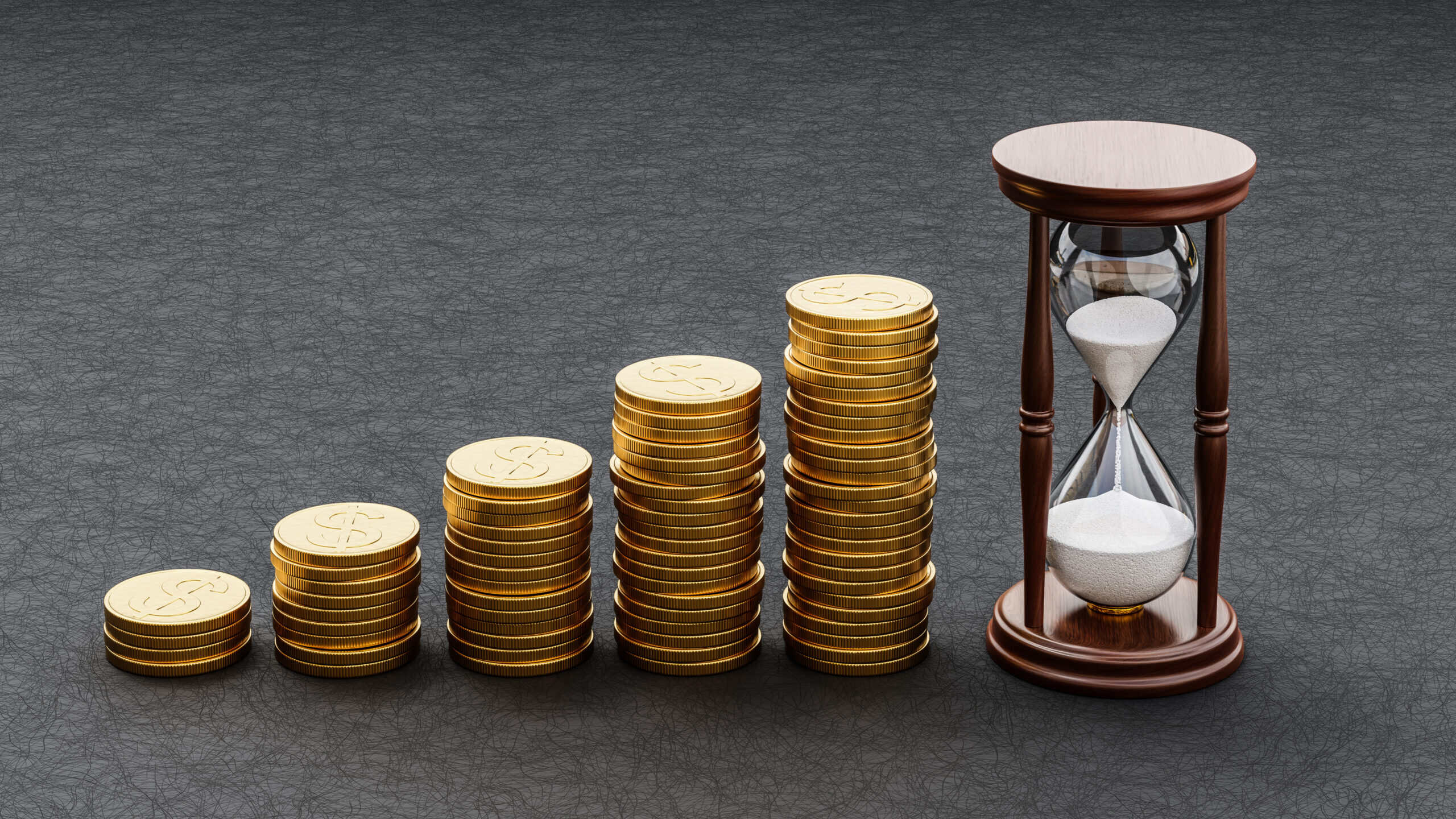 Piles of increasing coins alongside an hourglass.
