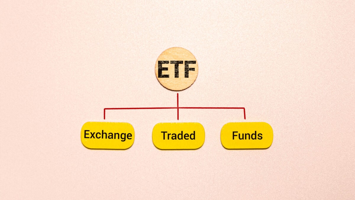 Exchange traded fund in yellow bubbles, underneath red lines with ETF in black and a light brown circle above.