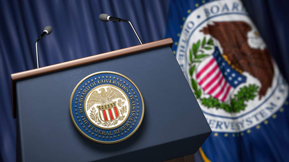 Press conference set up with symbol and flag of Federal Reserve.