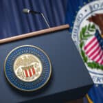 Press conference set up with symbol and flag of Federal Reserve.