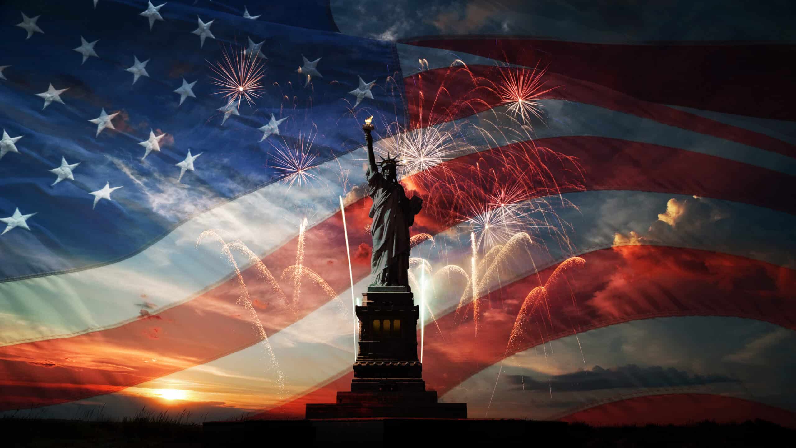 Statue of Liberty with the American flag in the background.
