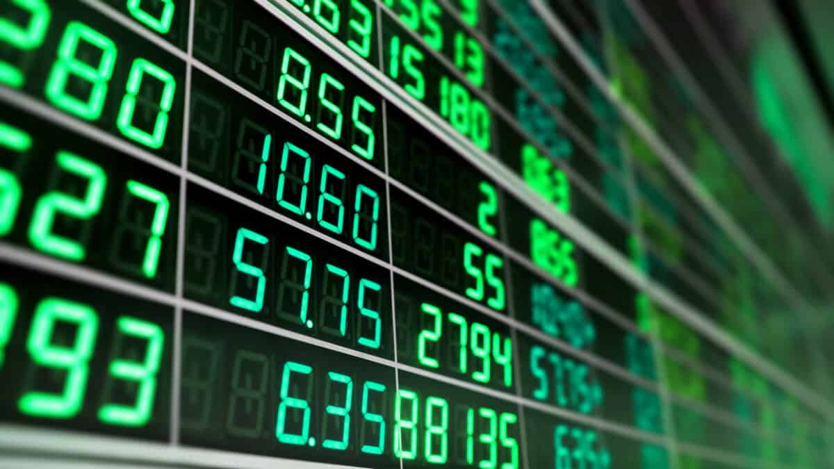Stock market board with green numbers.