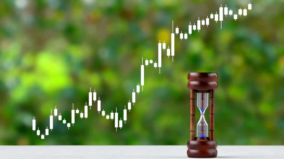 Hour glass with graph points rising.