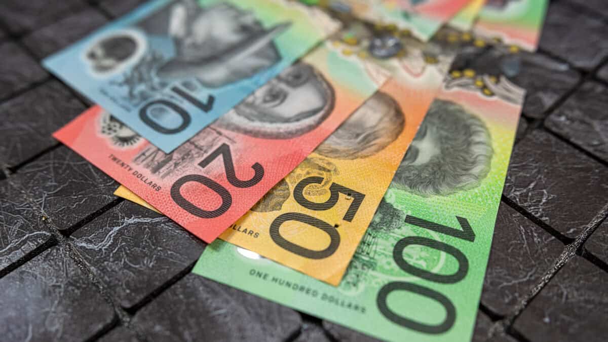 Numerous Australian dollar notes laid out.