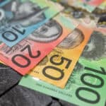 Numerous Australian dollar notes laid out.