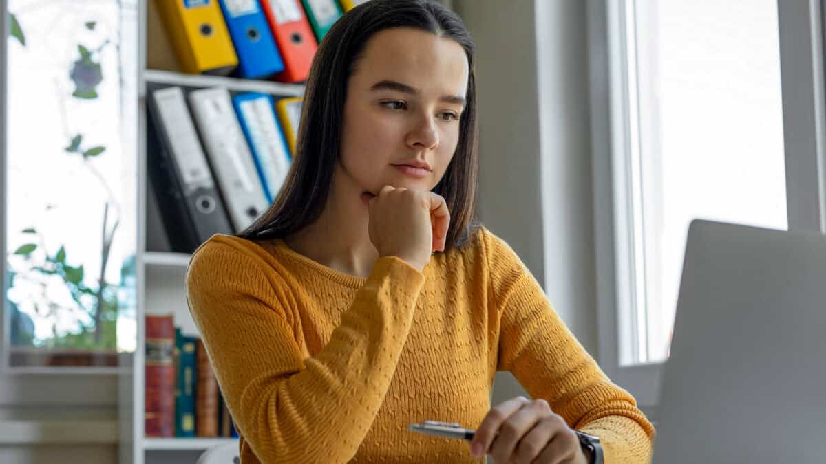 Woman looking at data on her laptop.