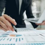 Businessman planning and analysing investment data.