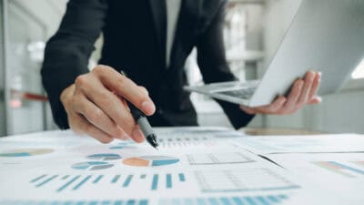 Businessman planning and analysing investment data.