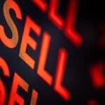 Sell written several times on board.