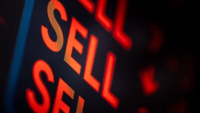 Sell written several times on board.