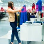 Woman checking out clothes at a shop.