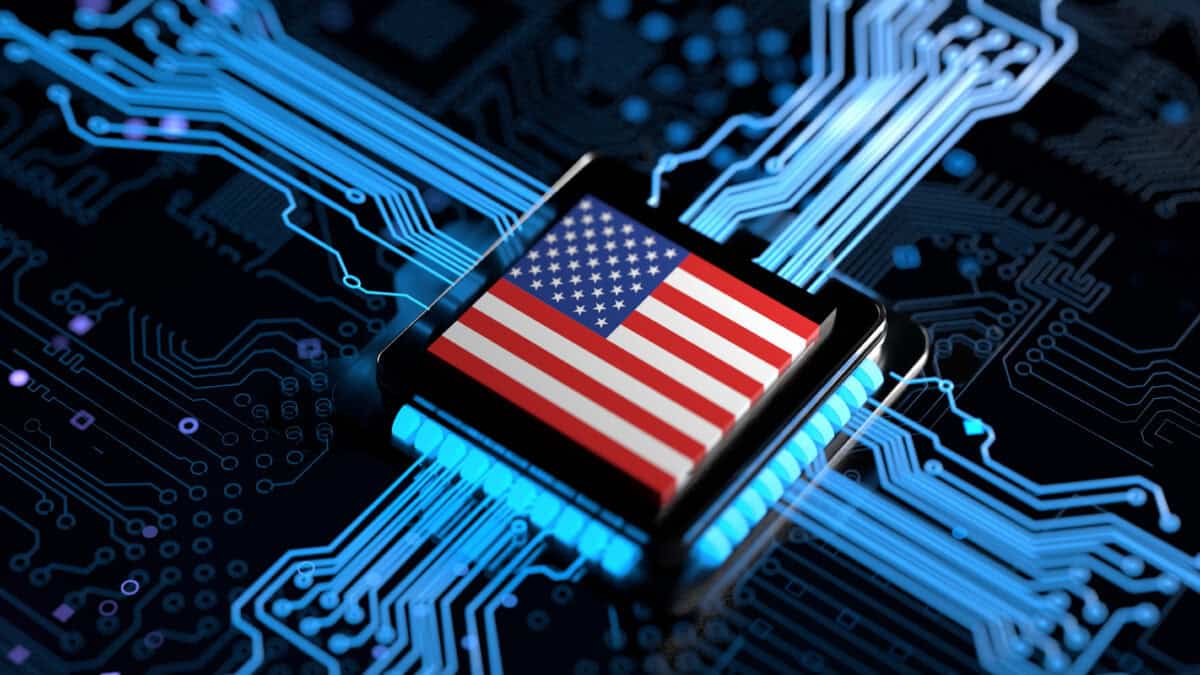 Processor chip on circuit board with USA flag.