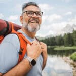 Man with a backpack hiking outdoors.