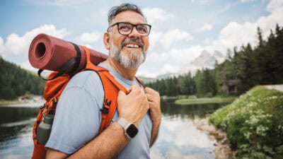 Man with a backpack hiking outdoors.