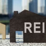 House models with REIT written on one.