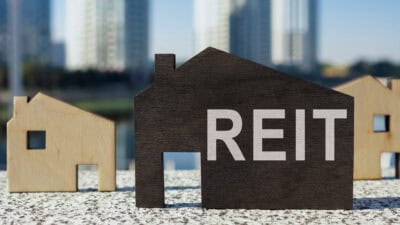 House models with REIT written on one.