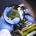 Magnifying glass on semiconductor chip.