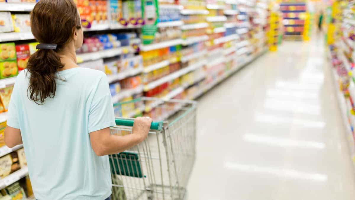 Woman pushing her trolley at a supermarket.
