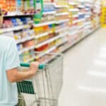 Woman pushing her trolley at a supermarket.