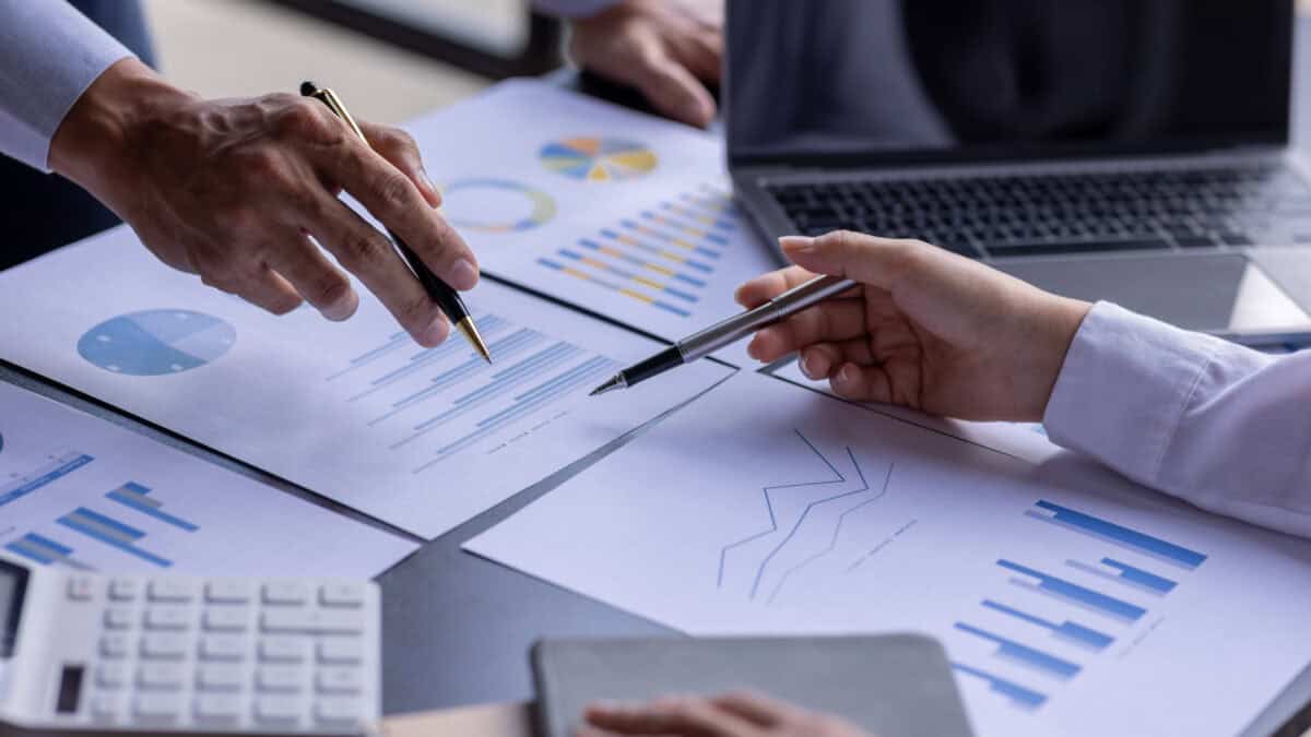 Two work colleagues analysing company financials.