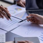 Two work colleagues analysing company financials.