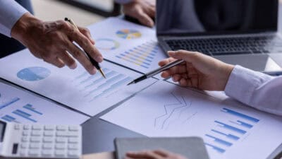 Two work colleagues analysing company financials.