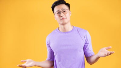 Man with his hands out as if pondering his options.