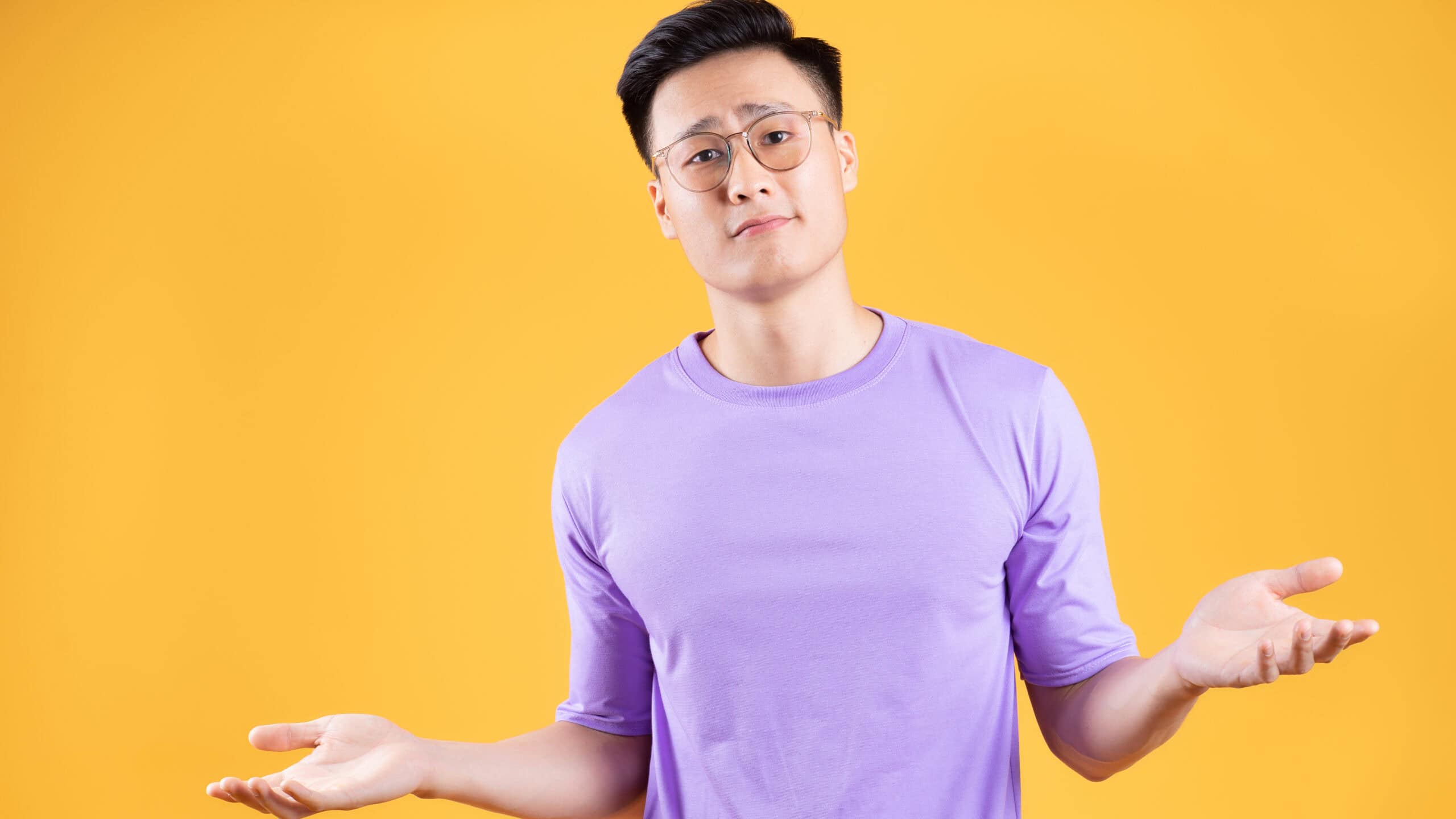 Man with his hands out as if pondering his options.