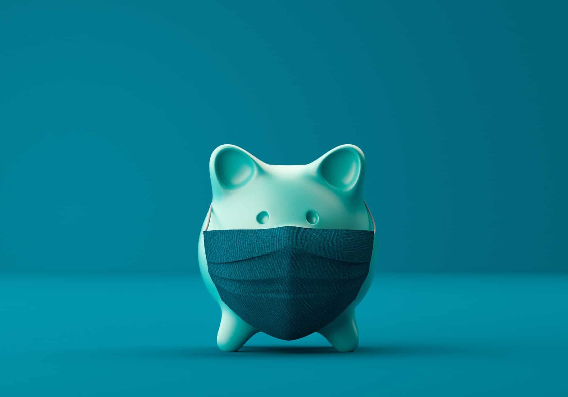 Green piggy bank with covid mask on